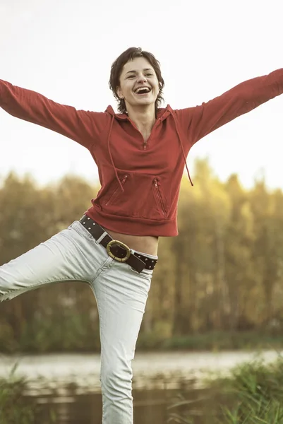 Portrait of yiungwoman holding hands up — Stock Photo, Image