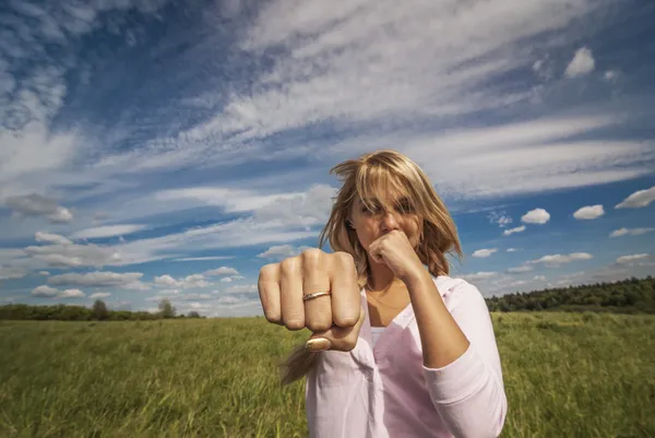 Girl beats fist — Stock Photo, Image