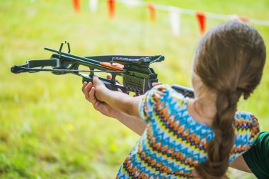 Little girl shooting crossbow clipart