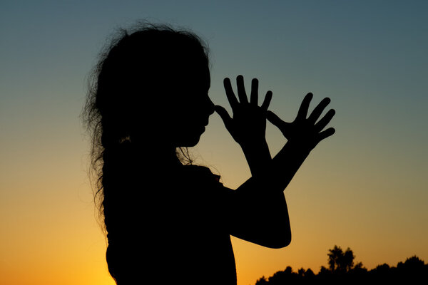 Silhouette of little girl