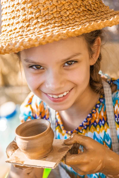 Little girl with pot — Stock Photo, Image
