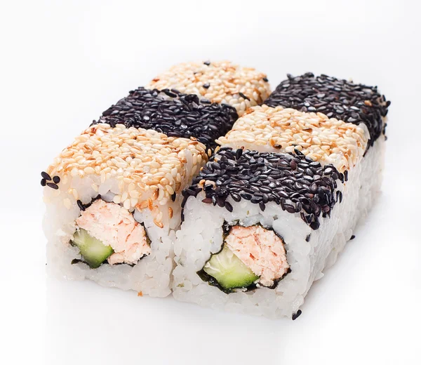 Sushi roll with fish and cucumber in sesame — Stock Photo, Image