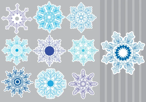 Conjunto de flocos de neve decorativos — Vetor de Stock