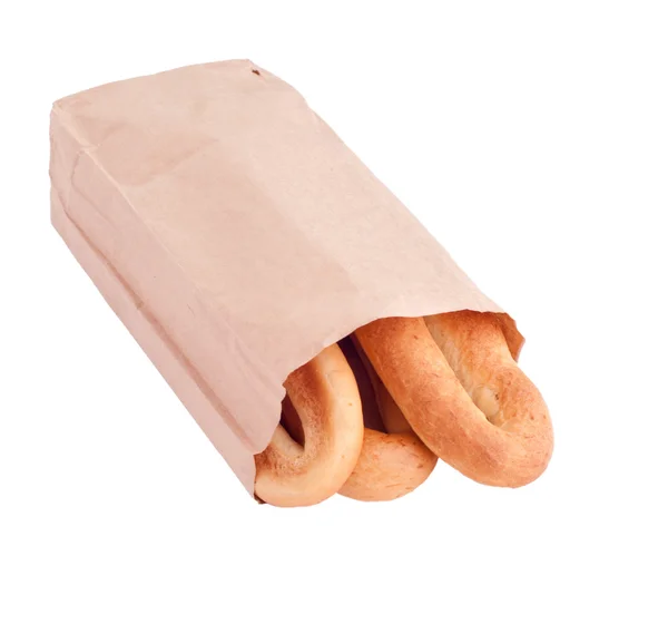 Tre bagels i en brun papperspåse — Stockfoto