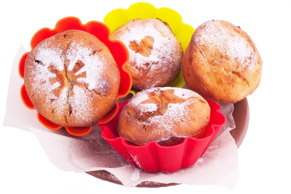 Muffin with icing sugar star, heart and sun in color forms — Stock Photo, Image