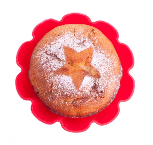 Muffin with icing sugar star in red form — Stock Photo, Image