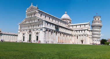 Crowds of tourists visit the cathedral and the leaning tower of Pisa. Piazza dei miracoli, Pisa, Italy. clipart