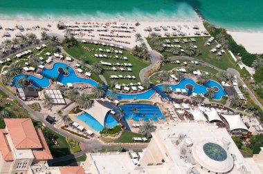 Pool and beach area of the luxury hotel in Dubai Marina, United Arab Emirates clipart