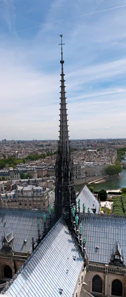 View on tall spire of Notre Dame fron the top of cathedral. France — Stock Photo, Image