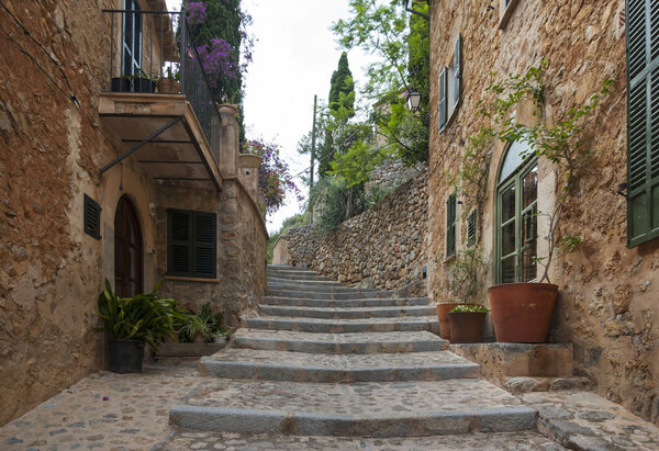 Street of mountain village Deia, Mallorca, Spain
