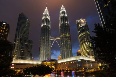 KUALA LUMPUR, MALAYSIA - 31 JANUARY, 2020: The Petronas Towers, also known as the Petronas Twin Towers are twin skyscrapers in Kuala Lumpur, Malaysia