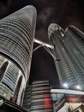 KUALA LUMPUR, MALAYSIA - 31 JANUARY, 2020: The Petronas Towers, also known as the Petronas Twin Towers are twin skyscrapers in Kuala Lumpur, Malaysia