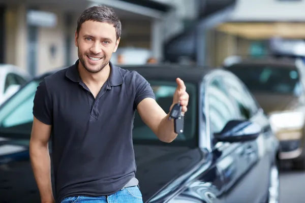Man with car keys Stock Picture