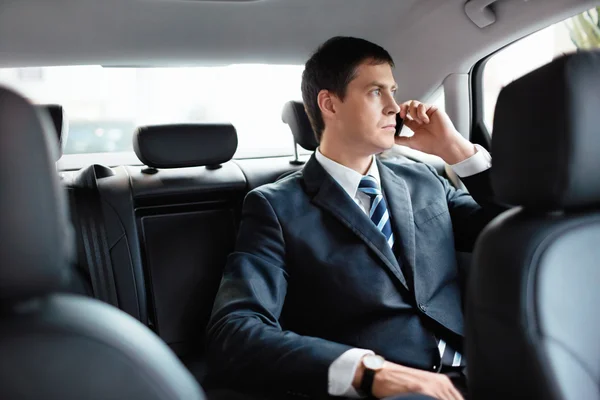 Businessman in a car — Stock Photo, Image