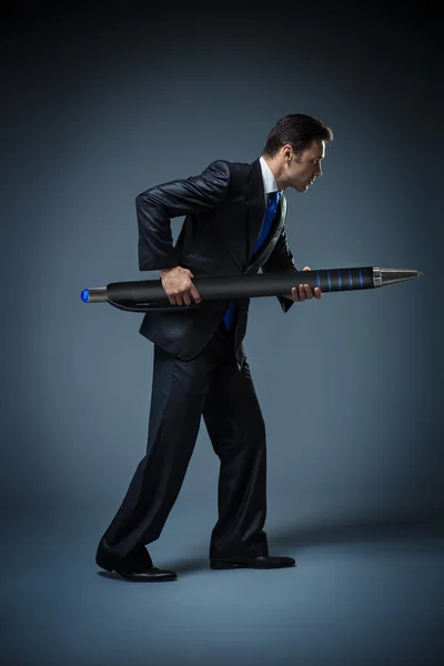 Businessman with a big pen — Stock Photo, Image