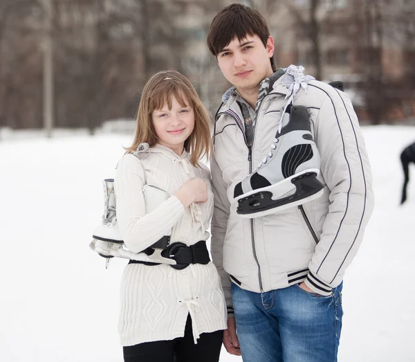Portrait of young couple on ice skate rink — Stock Photo, Image