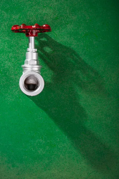 Valve on green background — Stock Photo, Image