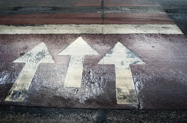 Three white arrow road markings — Stock Photo, Image