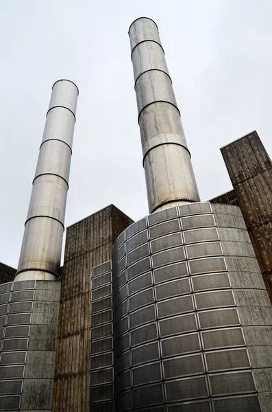 Industrial building and two metal chimney — Stock Photo, Image