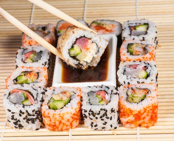 Different types of Sushi in a plate isolated on white background — Stock Photo, Image