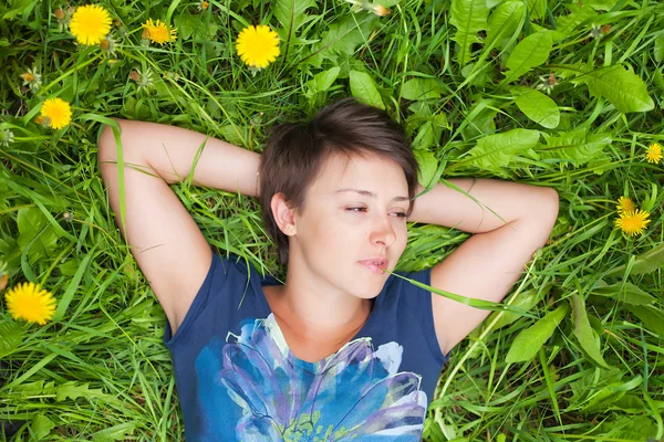 Girl on dandelion — Stock Photo, Image