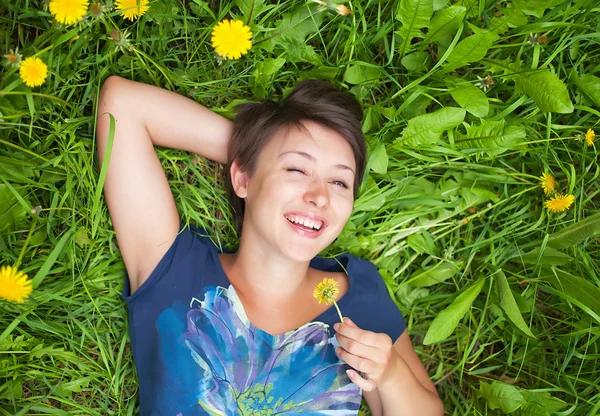 Girl on dandelion — Stock Photo, Image