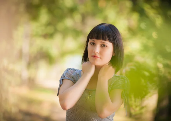 Beautiful girl in a forest — Stock Photo, Image