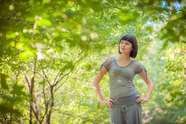 Beautiful girl in a forest — Stock Photo, Image