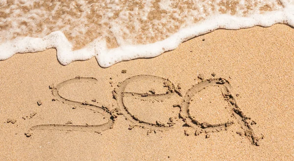 Word Sea Written in the Sand on a Beach — Stock Photo, Image