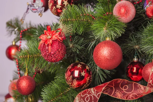 Christmas tree branch with a gift — Stock Photo, Image