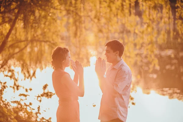 Portrait of young couple in park — Stock Photo, Image