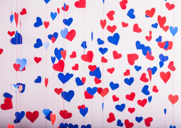 Achtergrond van rood en blauw papier harten — Stockfoto