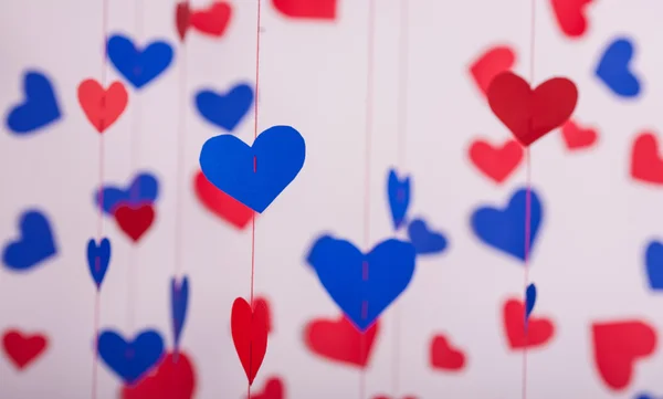 Achtergrond van rood en blauw papier harten — Stockfoto