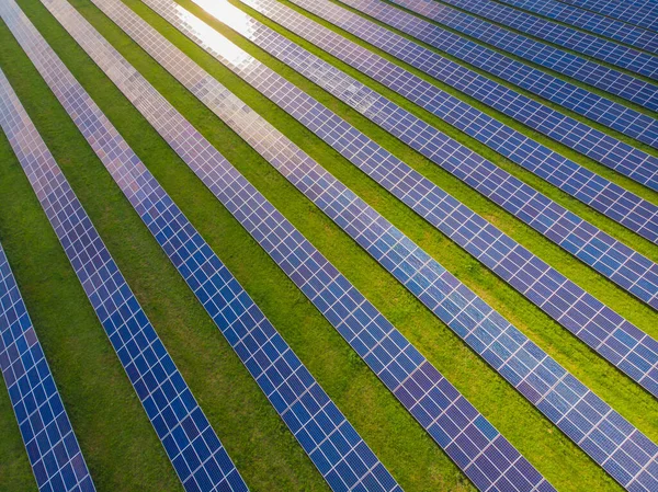 Solar cell energy farm. High angle view of solar panels on an energy farm. full frame background texture. Aerial view Power plant and Green Energy and global warming concept.