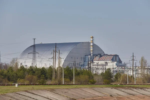 Reactor 4 at the Chernobyl nuclear power plant with a new confinement. Global atomic disaster. Chernobyl Exclusion Zone. Pripyat in the area of the sarcophagus over a blasted nuclear reactor