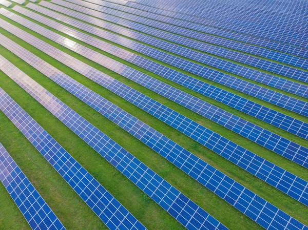 Solar cell energy farm. High angle view of solar panels on an energy farm. full frame background texture. Aerial view Power plant and Green Energy and global warming concept.