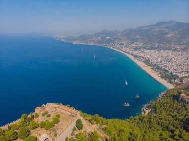 Drone photo of Alanya coast with Mediterranean turquoise sea and mountains, Turkey