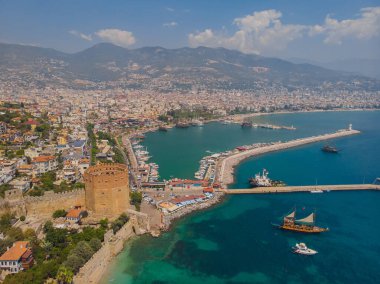 Awesome view of the Kizil Kule by the Mediterranean Sea in Alanya, Turkey. The Red Tower is a popular tourist attraction in Turkey.