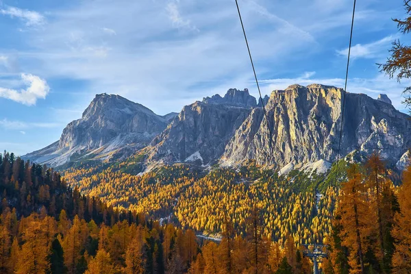 Ski lifts along the ski slope near the Cinque Torri mountains the background Tofane mountain near the famous town of Cortina d\'Ampezzo, Dolomites Mountains in Italy