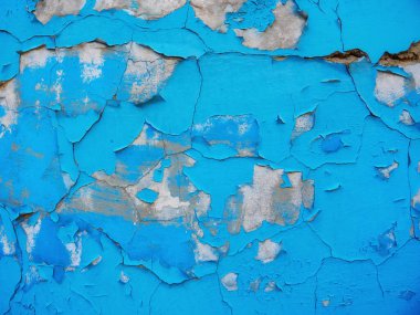 Eski çatlak duvar arka planı, kirli grunge dokusu. Boya soyan alçı duvarlar. Beton duvarlar kırılmış. Mavi boya ve boyası soyulmuş.