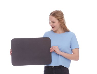 Vivacious young woman winking and laughing as she points at a blank signboard with copy space. isolated on white