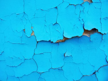 Duvardaki pürüzsüz dokudaki boyayı soyuyordum. Kırsal mavi grunge maddesi deseni.