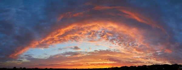 Sunset sky, clouds painted in bright colors over Kyiv, Ukraine