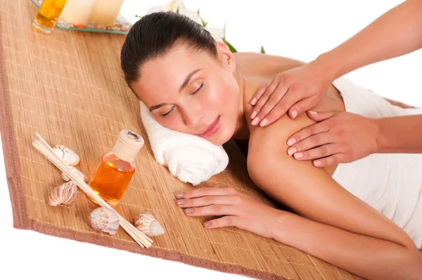 Relaxed beautiful young woman having a spa massage on her back — Stock Photo, Image