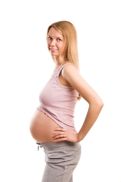 Beautiful young pregnant blonde girl on white background Stock Photo