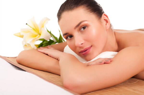 Portrait of young beautiful woman in spa environment