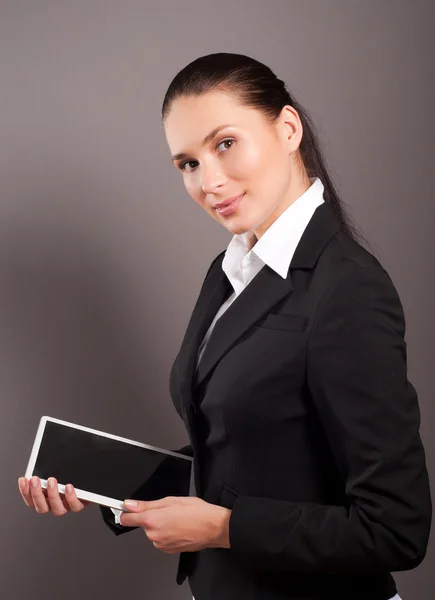 A young businesswoman holding her digital tablet pc — Stock Photo, Image