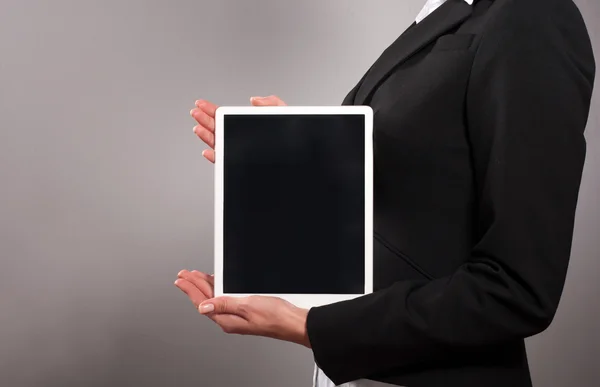 A young businesswoman holding her digital tablet pc Stock Image