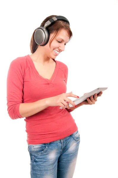 Young student girl with tablet pc and headphones — Stock Photo, Image