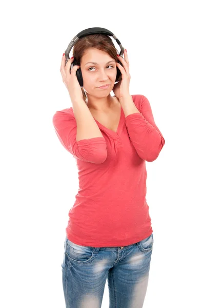 Happy young woman with headphones isolated over a white backgrou Stock Image